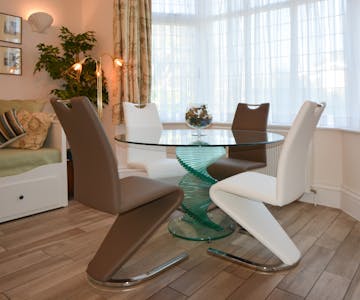 Haven Hall Hotel Garden Suite 1 glass dining table & mermaid chairs