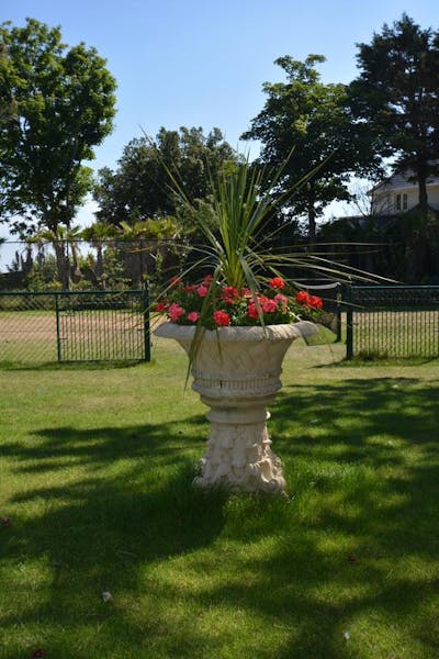 Haven Hall Hotel. View of urn with Tennis Court behind