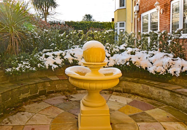 Haven Hall Hotel back patio & fountain with snow