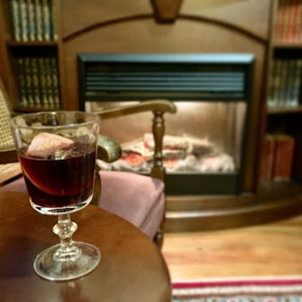 Enjoy a mulled wine in the warm Tongariro Crossing Lodge guest lounge