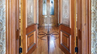 Front entry way with ornate wood flooring at Limestone Mansion