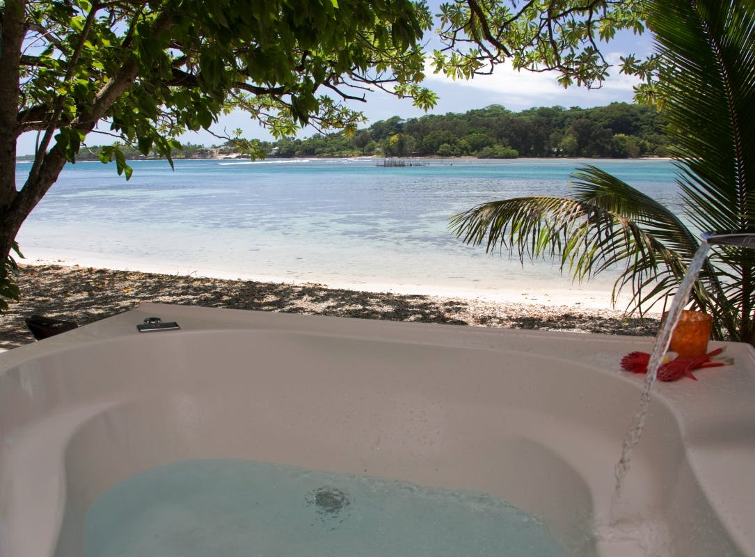 Beachfront Deluxe Spa Villa - 2 person Spa on the deck where you can relax and enjoy the amazing views erakor island