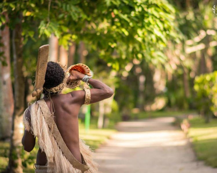 Conch shell blower warrior escort #erakorbeachweddings #weddingceremonyonthebeachsouthpacific #Vanuatutropicalbeachweddings