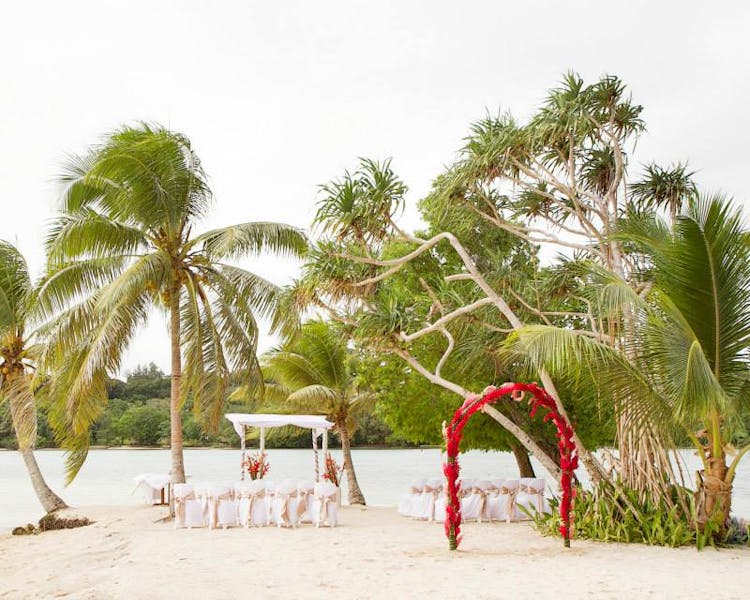 Coconut Beach Wedding Ceremony #erakorweddings #weddingceremonyonthebeach #Vanuatutropicalbeachweddings floral arch