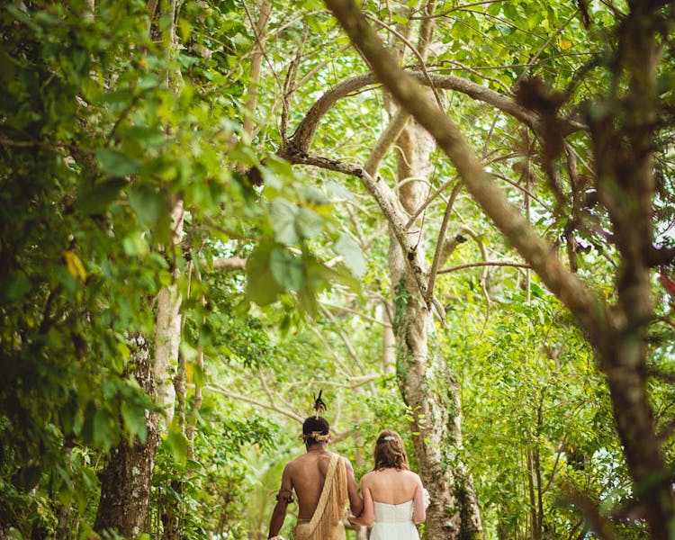 Tropical Island Wedding Aisle bridal arrival warrior escort #erakorbeachweddings #weddingceremonyonthebeachsouthpacific