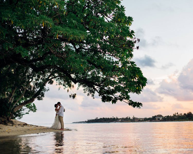 Sharing a romantic moment on Sunset Beach #erakorbeachweddings #weddingceremonyonthebeachsouthpacific #Vanuatu