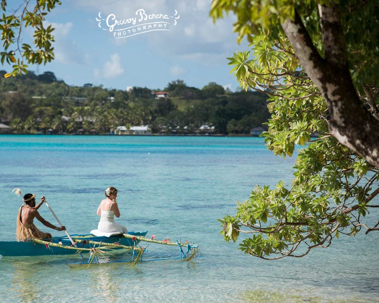 Arrive to your wedding on a traditional Outrigger Canoe bridal arrival #erakorbeachweddings #weddingceremonyonthebeach