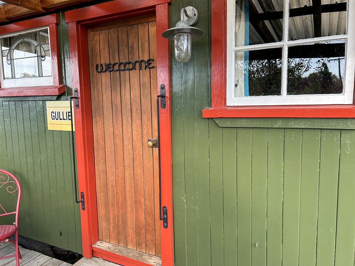 A rustic farm wagon cabin at Musterer's Accommodation, Fairlie.