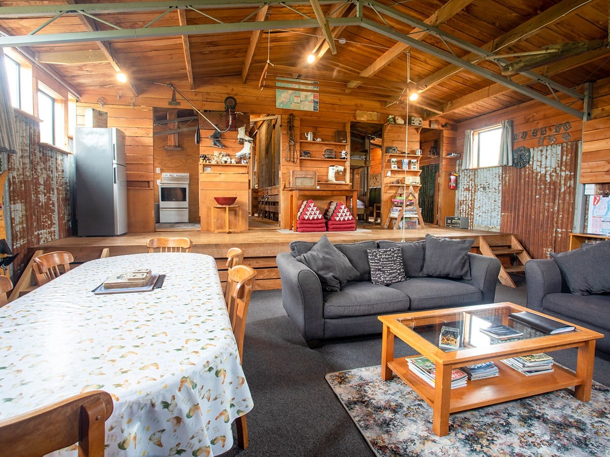 A large rustic living area in an old woolshed at Musterer's Accommodation, Fairlie.