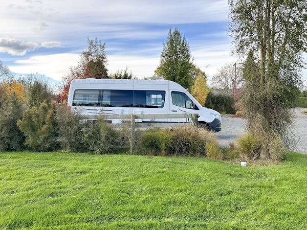 Campervan parking with lawn and shrubs at Musterer's Accommodation, Fairlie.