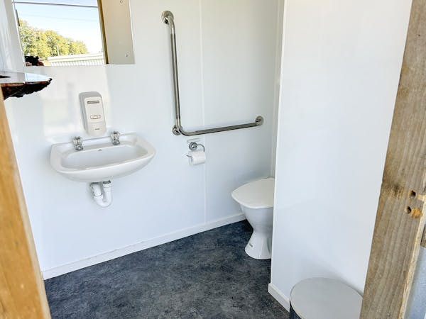 An accessible bathroom with hand rails at Musterer's Accommodation, Fairlie.