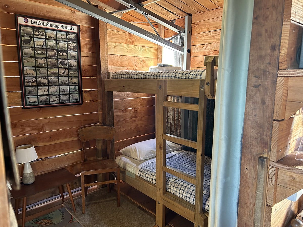 A rustic bunkroom with sturdy timber bunks at Musterer's Accommodation, Fairlie.