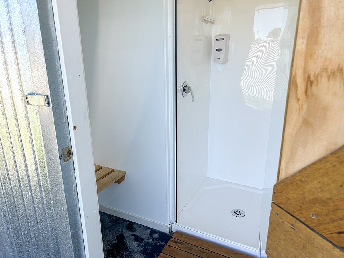 An accessible bathroom with shower seat at Musterer's Accommodation, Fairlie.
