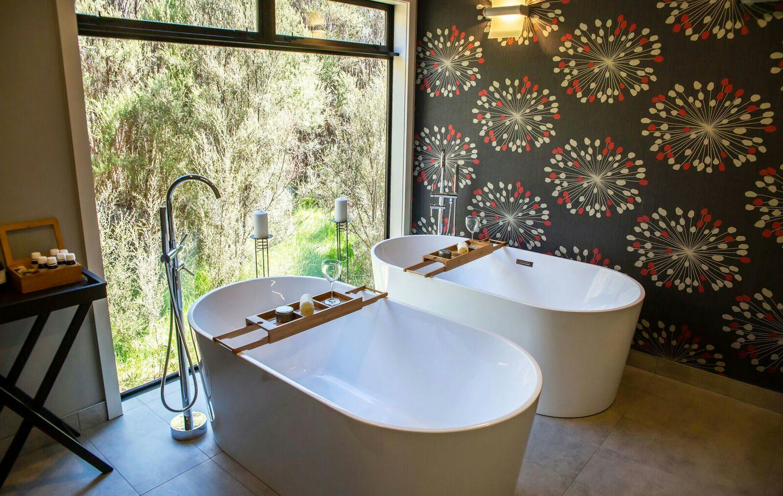 Twin baths with bush view