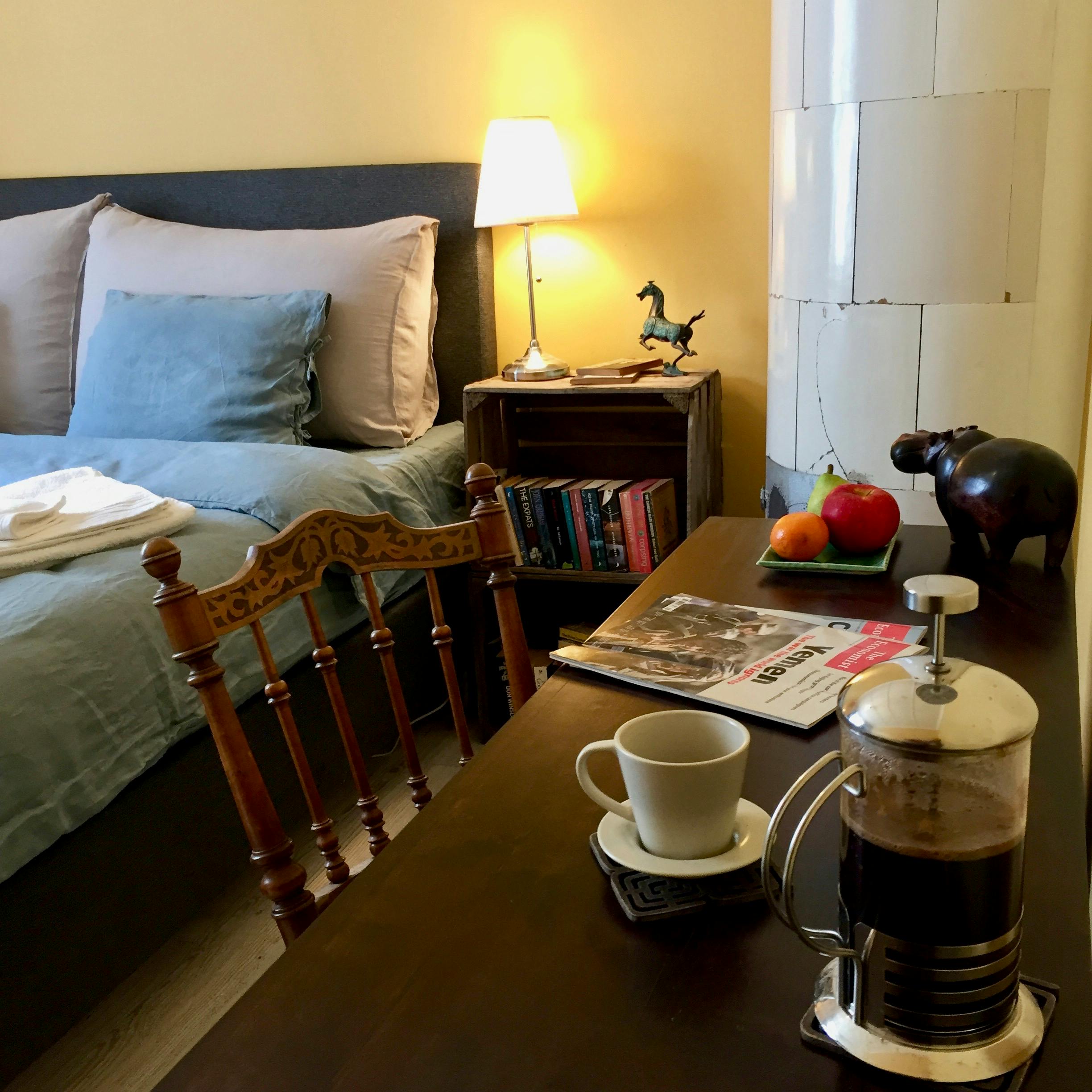 close up desk view of king size continental bed saffron room