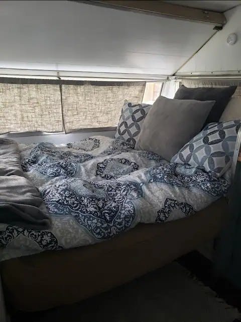 The vintage camper know as Palmer. A full futon for sleeping with a sitting area.