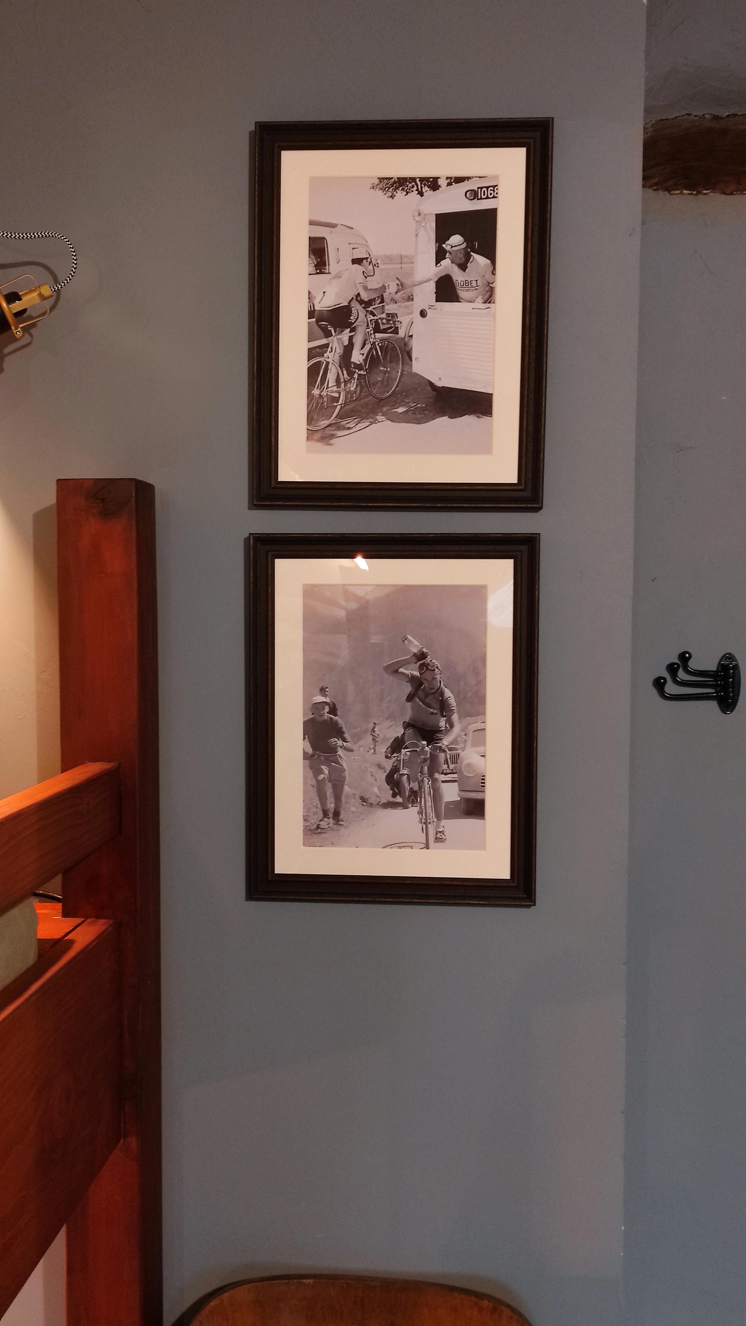 Close-up of retro pictures of race cyclists as decoration in a hostel-style room for cyclists at La Maison Vienvenue.