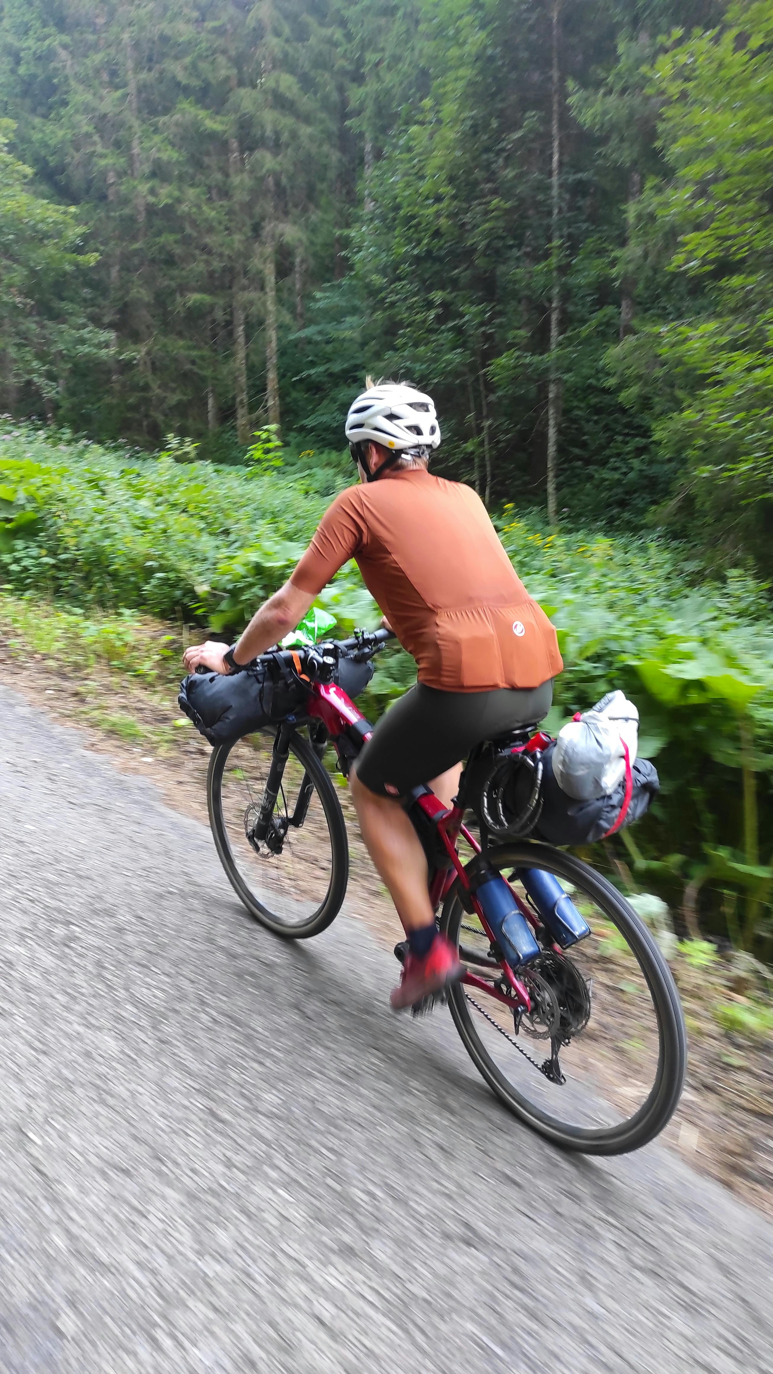 Cyclist bikepacking near La Maison Vienvenue.