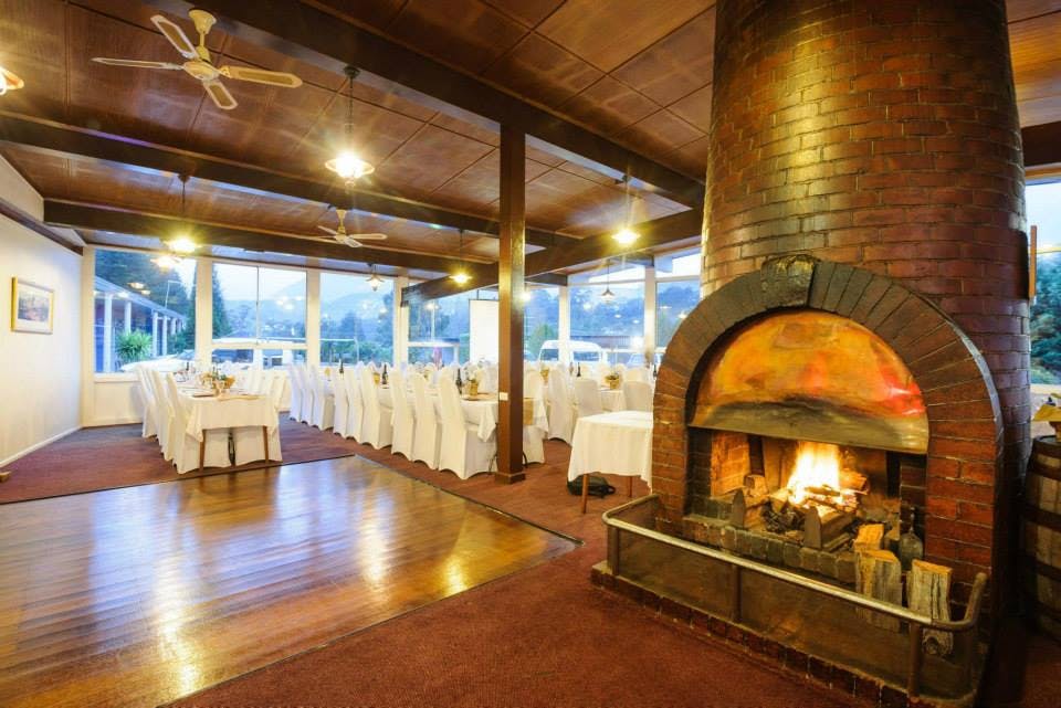 Restaurant dressed for function, fire lit