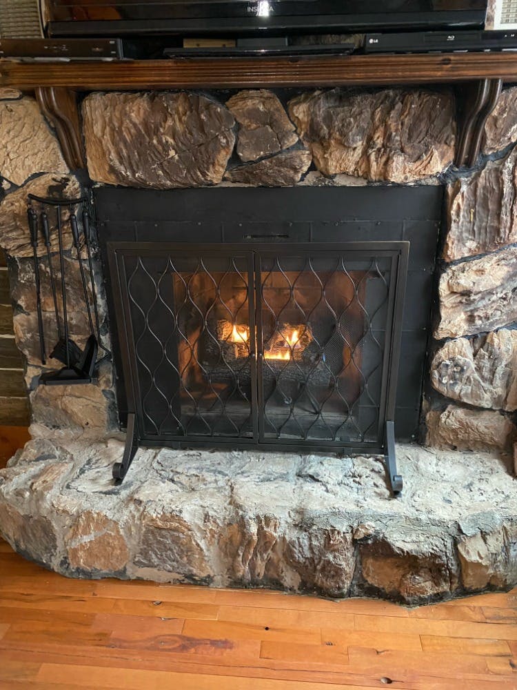 Lincoln Hills Cabin Fireplace at Best Bear Lodge & Campground. Irons, Michigan