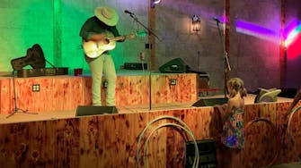 alt="Waylon Hanel performing live in the Rhinestone Event Center at Best Bear Lodge & Campground in Irons Michigan"