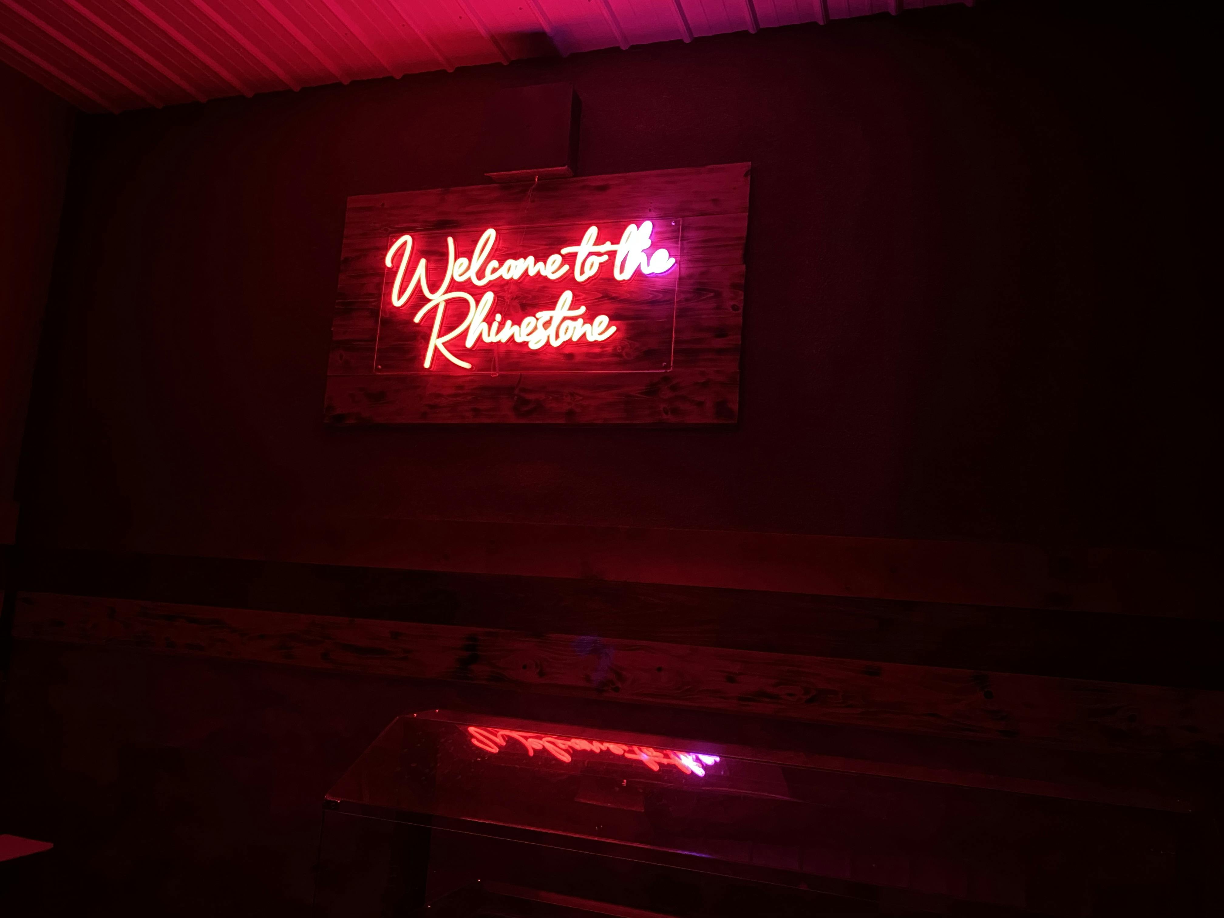 Rhinestone Event Center sign in the Rhinestone Event Center at Best Bear Lodge & Campground.