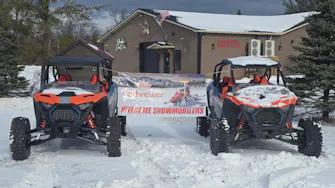 Welcome snowmobilers Budweiser sign tied to two Polaris RZR rentals