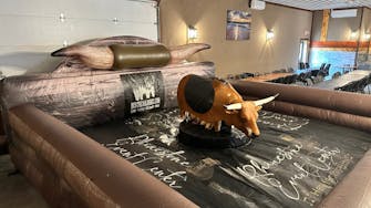 alt="Mechanical bull riding at Rhinestone Event Center, Best Bear Lodge & Campground in Irons Michigan"