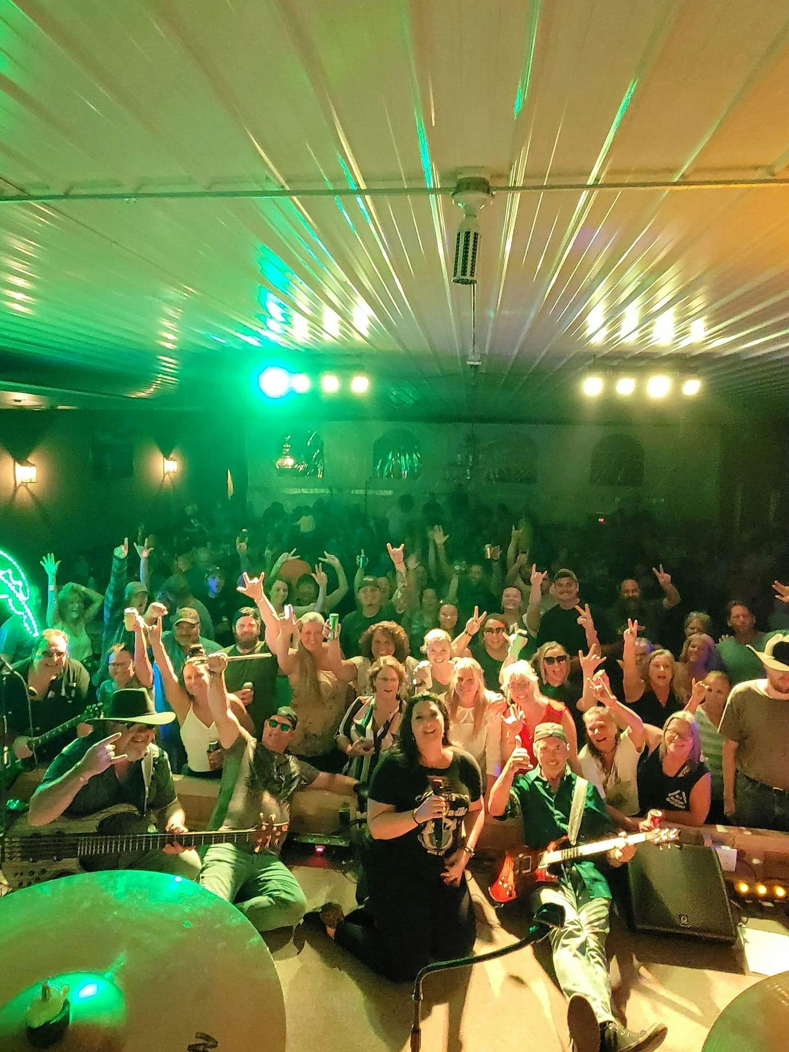Onager Band posing with the fans in the Rhinestone Event Center at Best Bear Lodge & Campground.