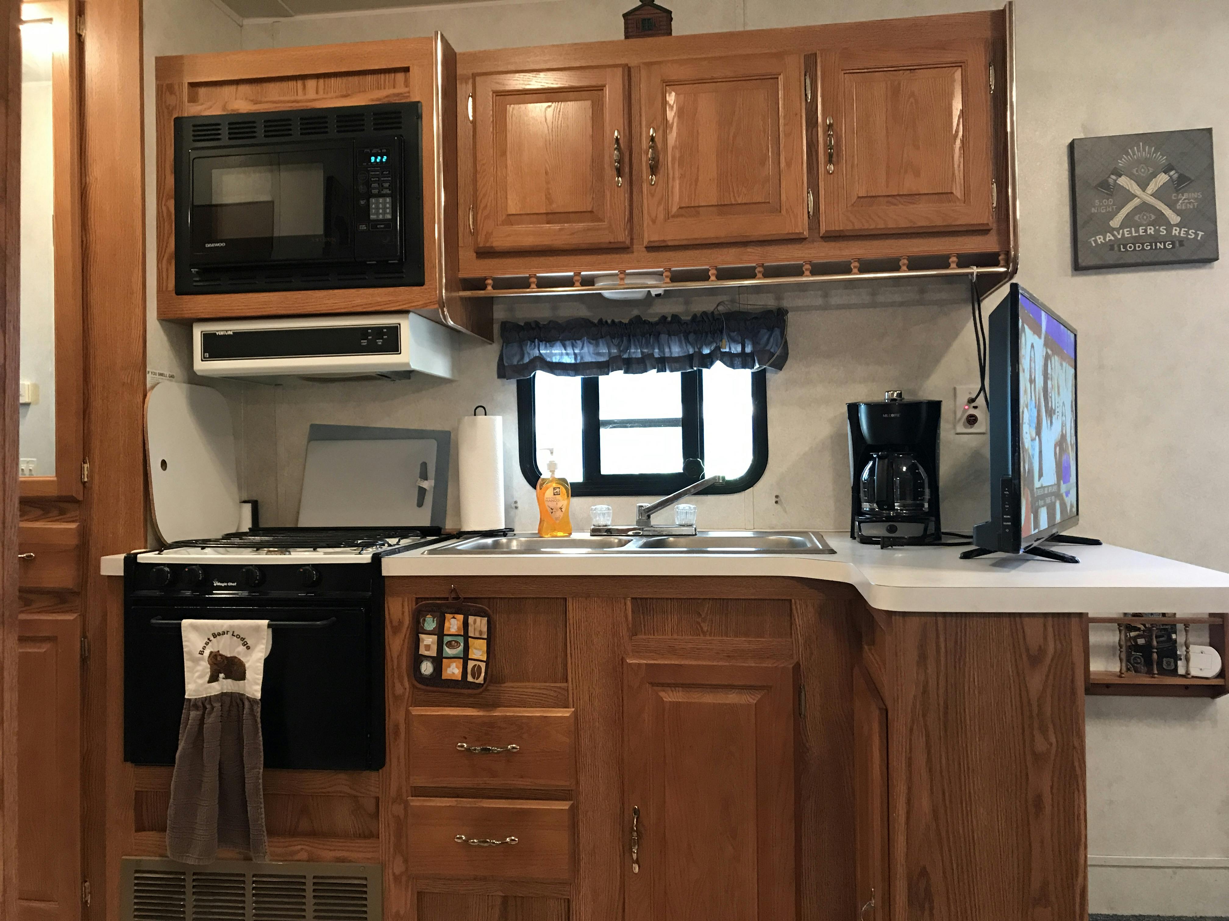 Explore More Destination RV Cabin, Fully Equipped Kitchen at Best Bear Lodge & Campground