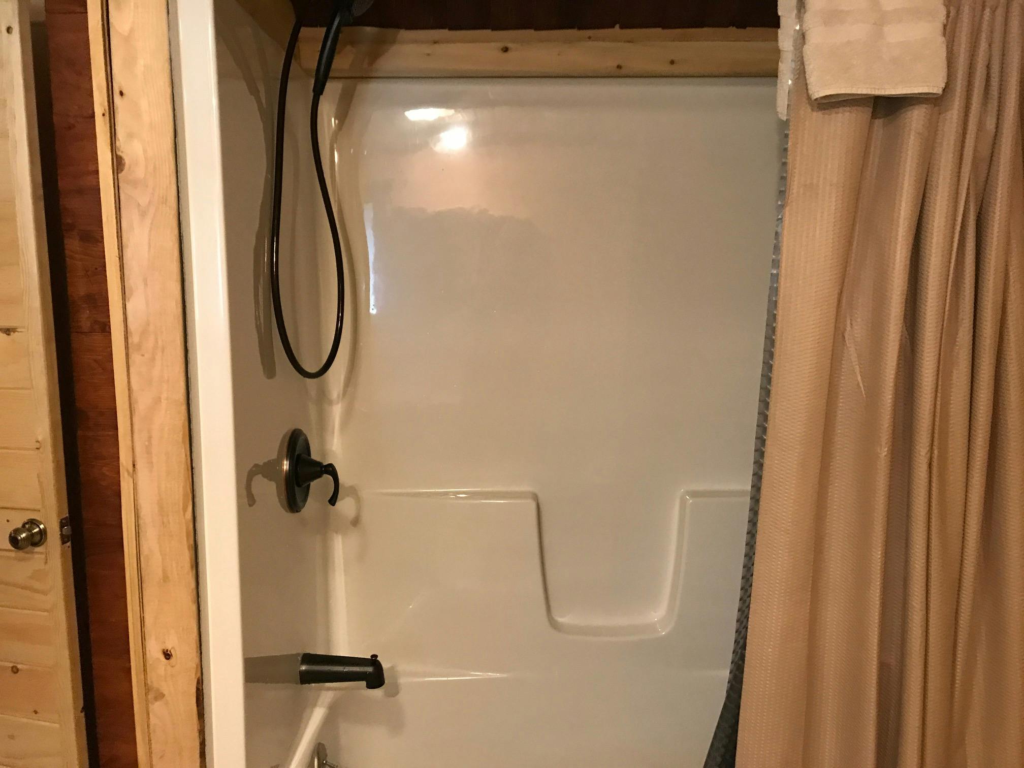 The Grand Daddy Cabin Sleeps Eight, New Shower Tub combo at Best Bear Lodge & Campground