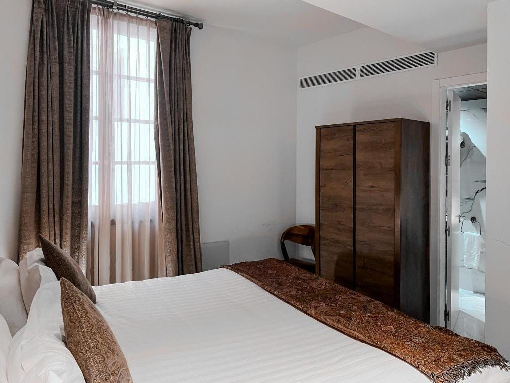 Cozy room with minimalist decor and wardrobe