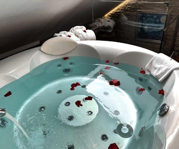 Jacuzzi with rose petals – Romantic relaxation in-room spa