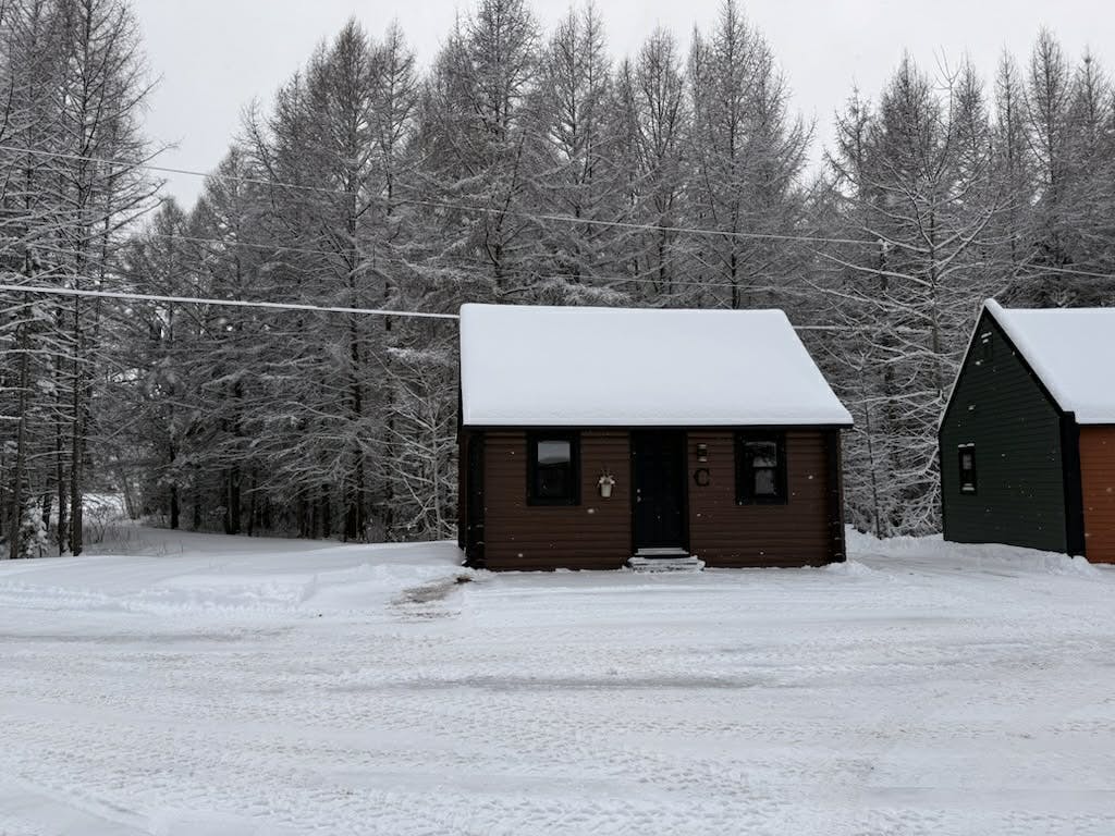 Chalet C and ski-doo trail in the back