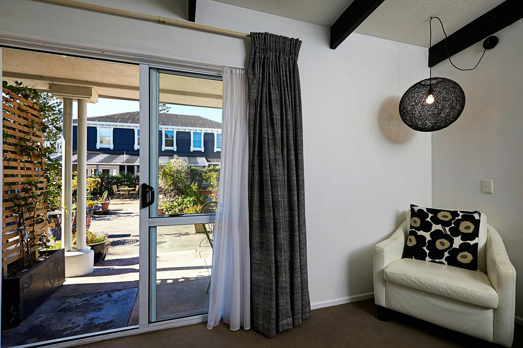 View from courtyard room into garden to rear of historic hotel building