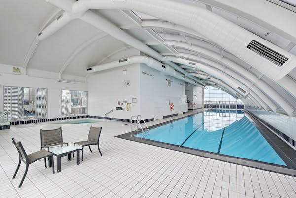 Heated Pool Spa and sauna, Fully equiped Gym Outdoor sundeck with chairs