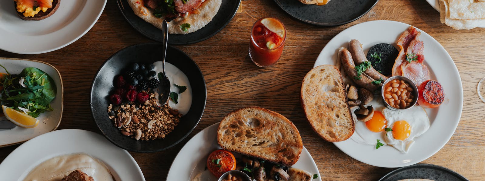 Breakfast spread at HS1, Royal Hotel, featuring a table laden with an assortment of delicious breakfast options.