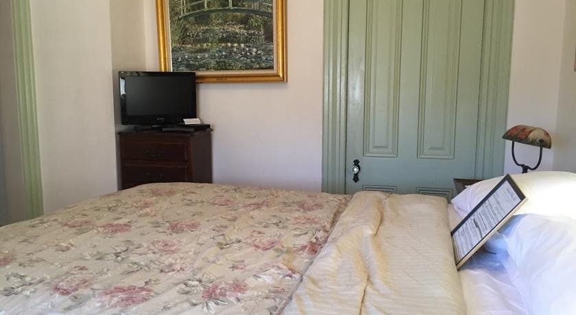 Chest, TV, and closet entrance in Tioga Room