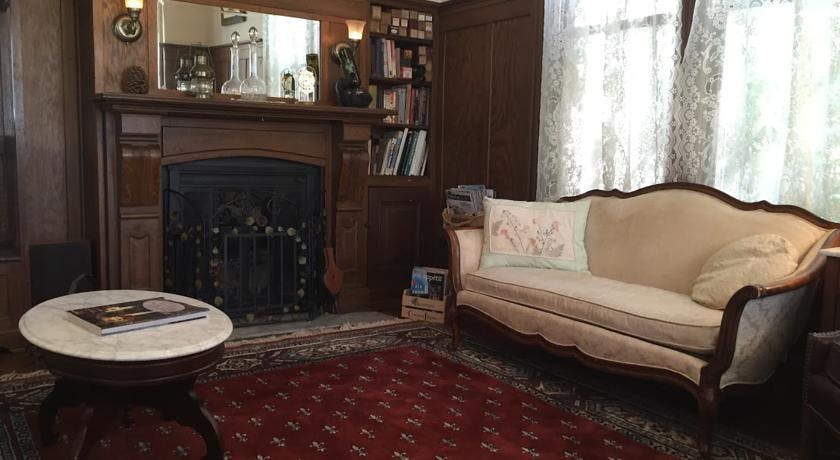 Fireplace and love seat in parlor