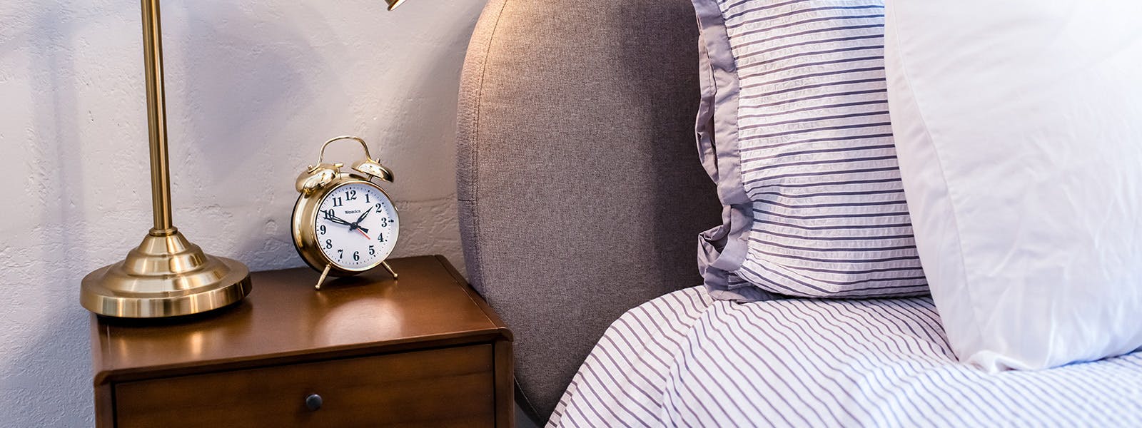 Luxury hotel room bed and nightstand Beulah Michigan