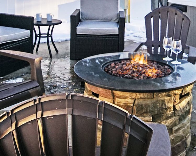 Outdoor fire table Coastal Suites Resort Michigan