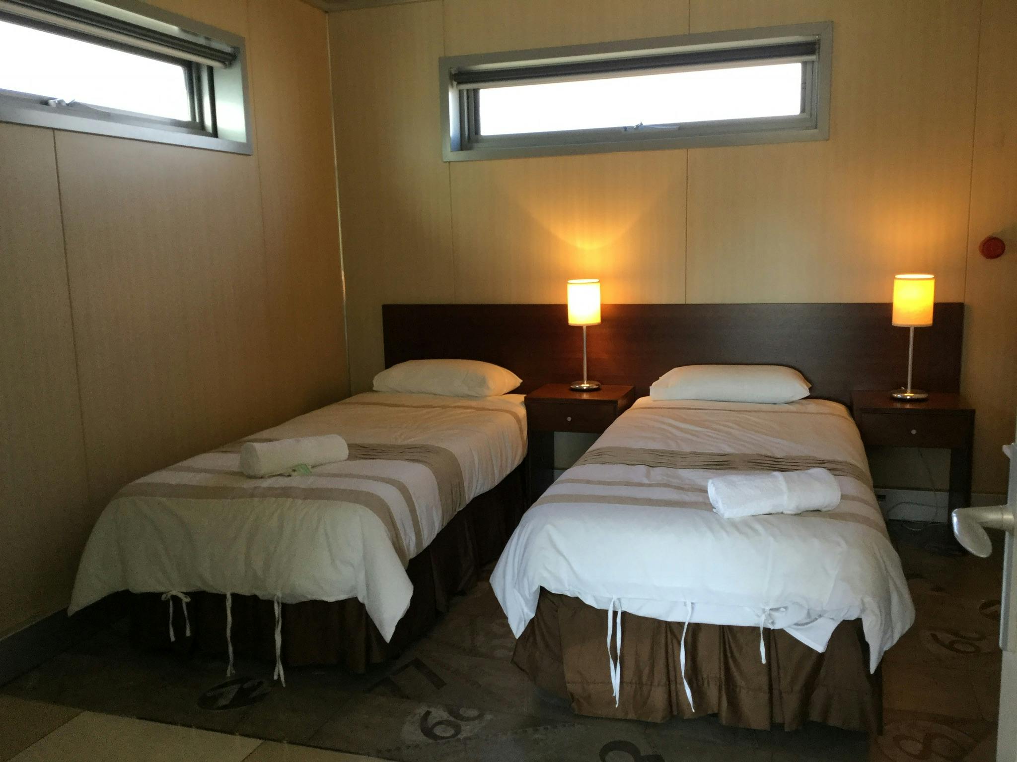 Two single beds in the second bedroom.