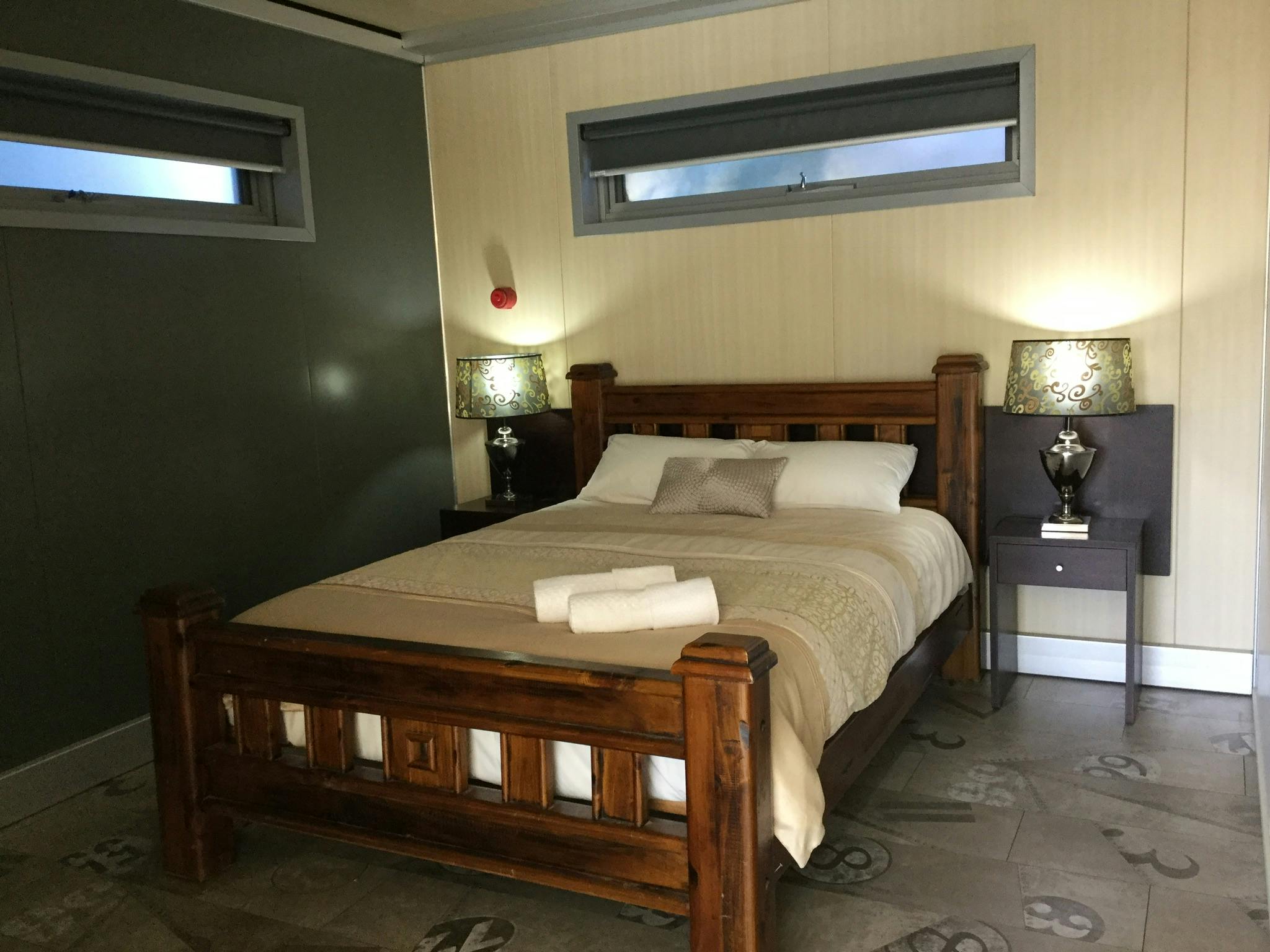 Comfortable queen size bed in the main bedroom.