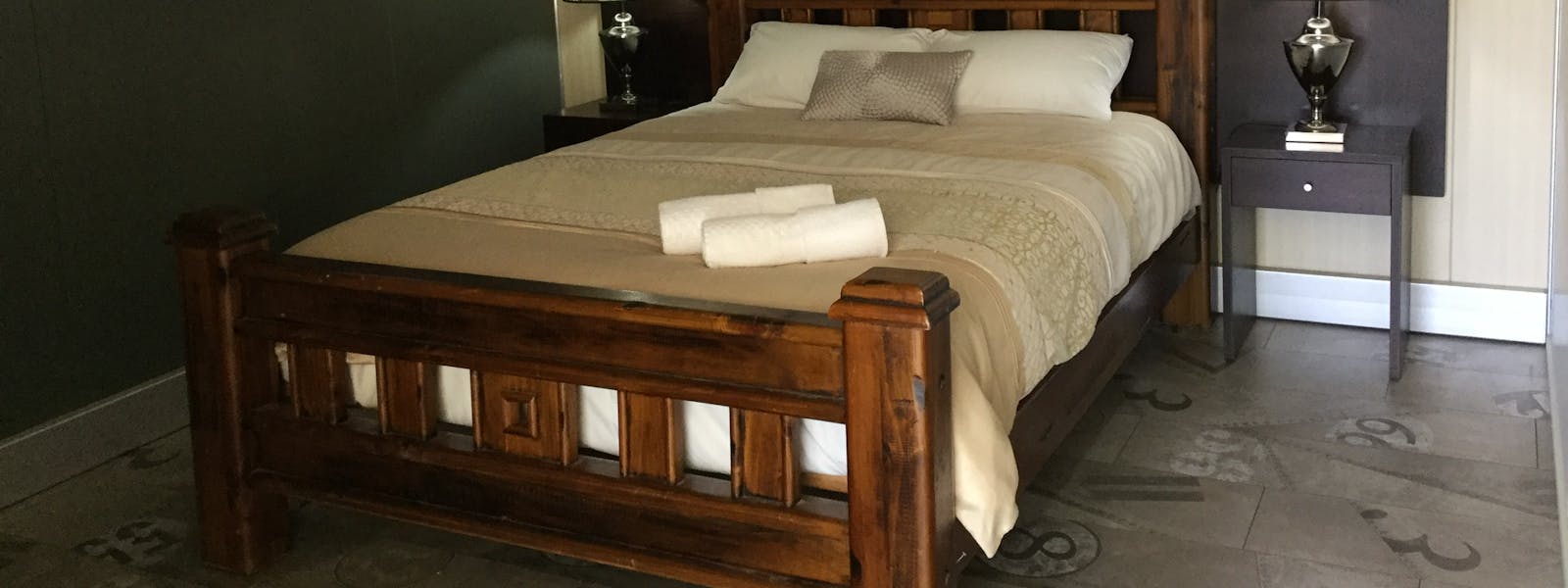 Comfortable queen size bed in the main bedroom.