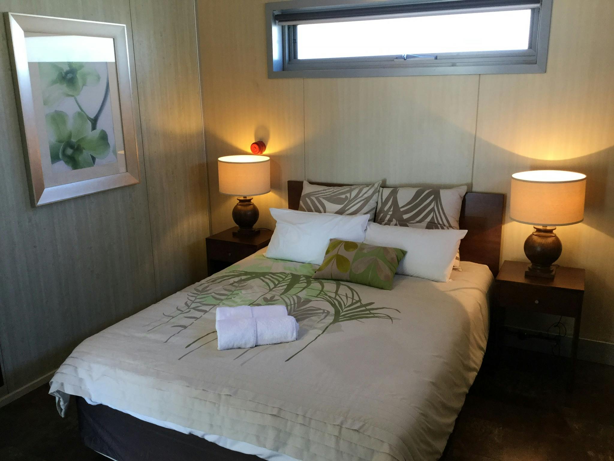 Comfortable queen size bed in second bedroom.