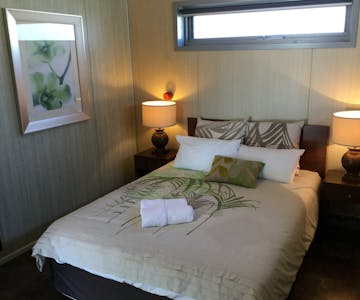 Comfortable queen size bed in second bedroom.