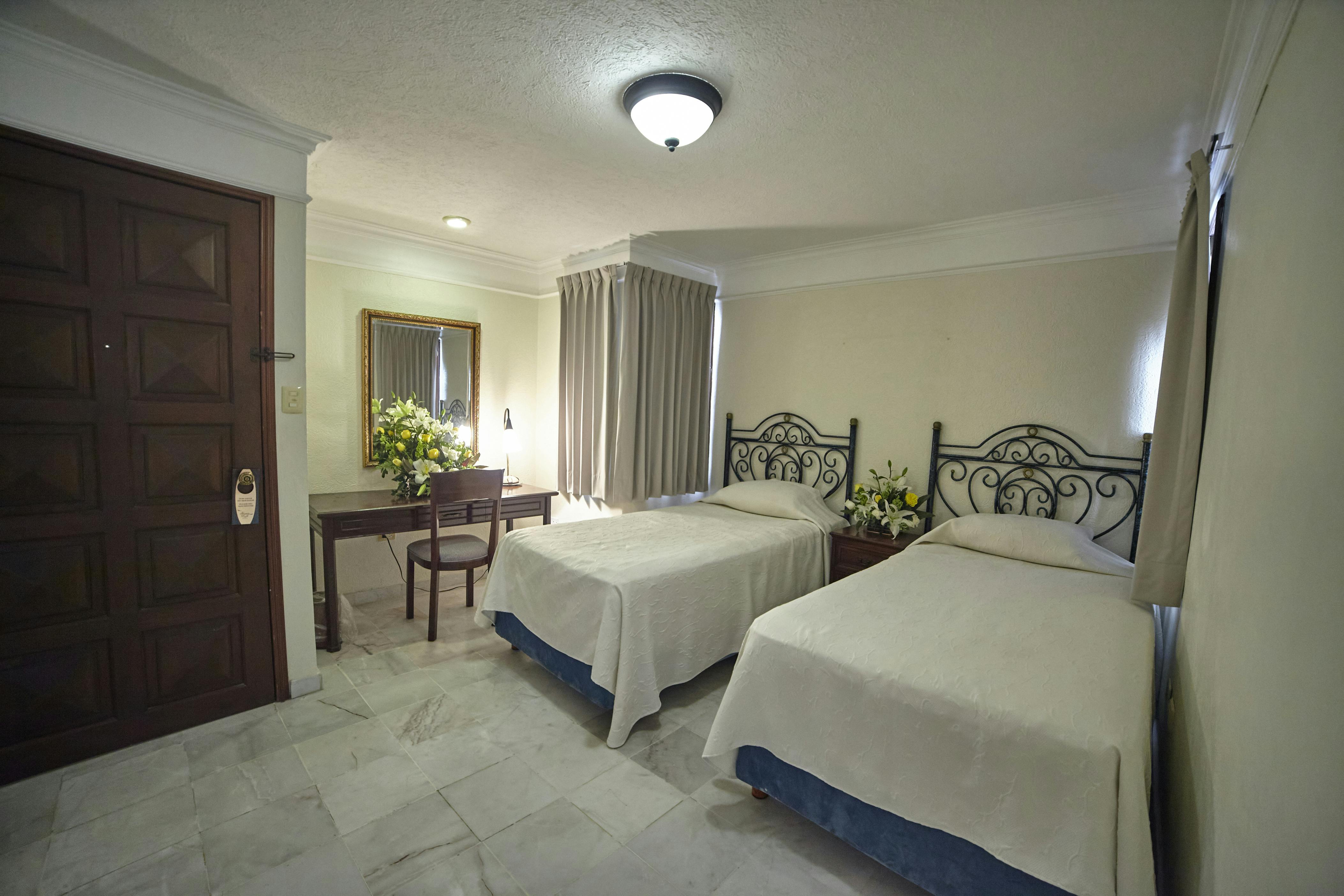 Junior Suite: Una cama king size y dos individuales