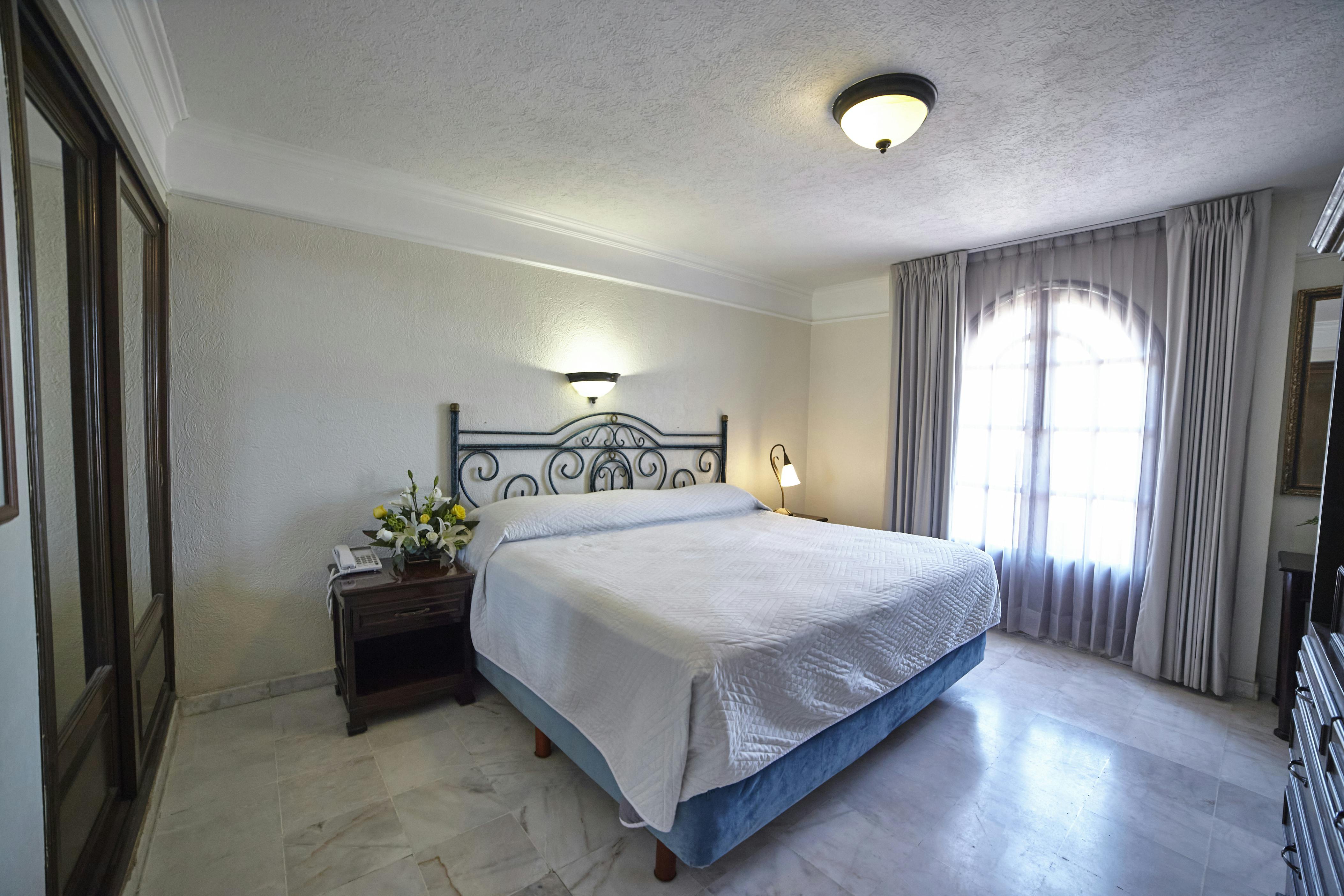 Junior Suite: Una cama king size y dos individuales