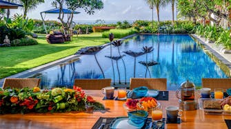 PRIVATE VILLAS OF BALI - Villa Frangipani - Villa Frangipani poolside breakfast setting.
