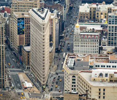 Flatiron building standing tall in Midtown Manhattan.